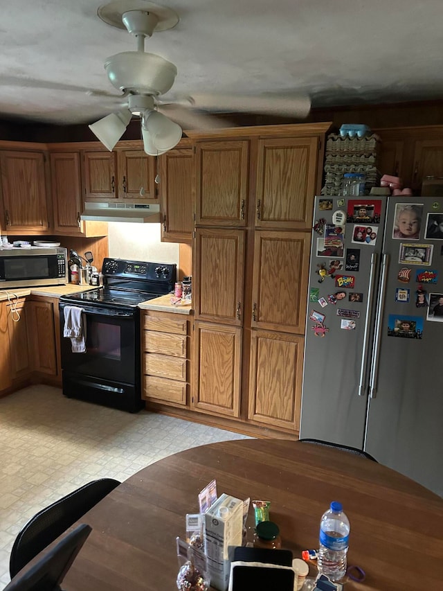 kitchen with ceiling fan and appliances with stainless steel finishes