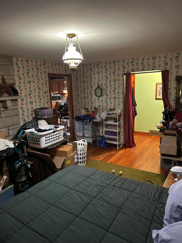 bedroom featuring wood-type flooring