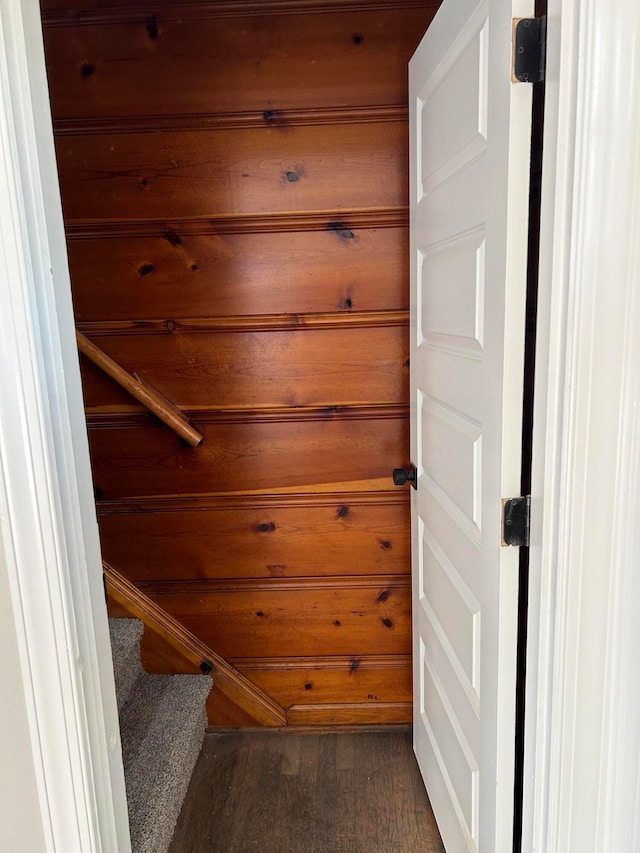 interior space with wood walls and hardwood / wood-style floors