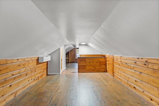 bonus room featuring hardwood / wood-style floors and vaulted ceiling