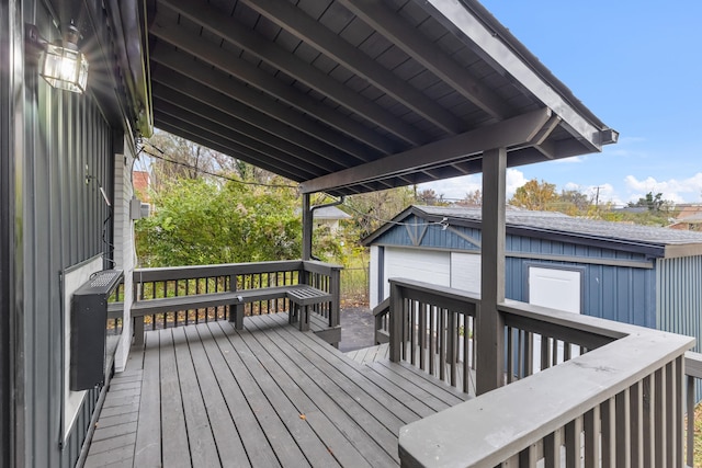 deck with an outbuilding and a garage