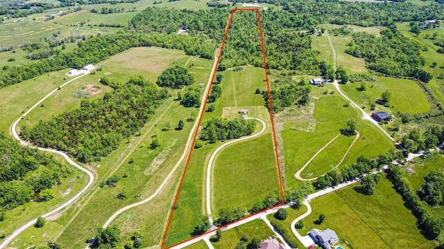 birds eye view of property featuring a rural view