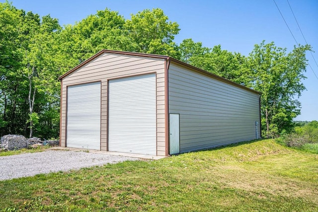 garage with a yard