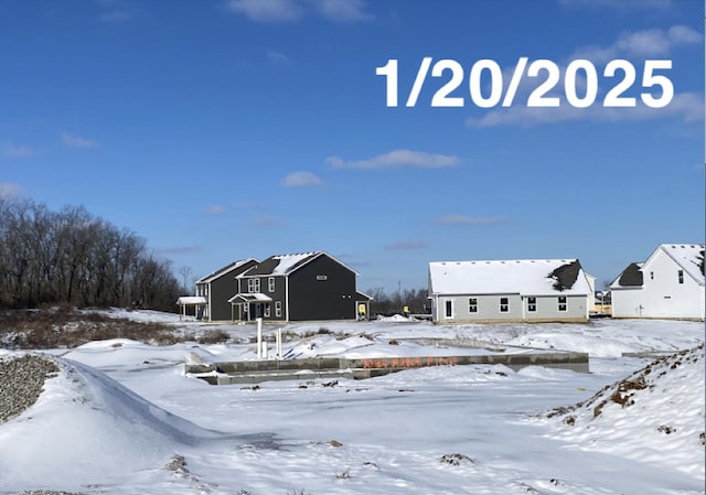 view of yard layered in snow