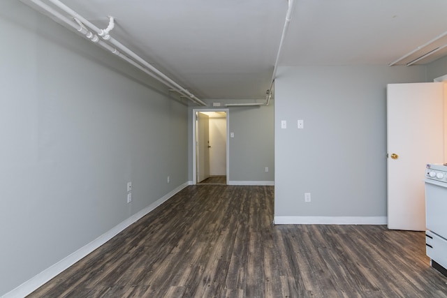 spare room with dark hardwood / wood-style floors