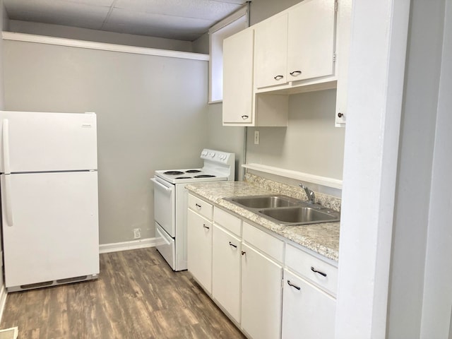 kitchen featuring white appliances, white cabinetry, sink, and dark hardwood / wood-style flooring