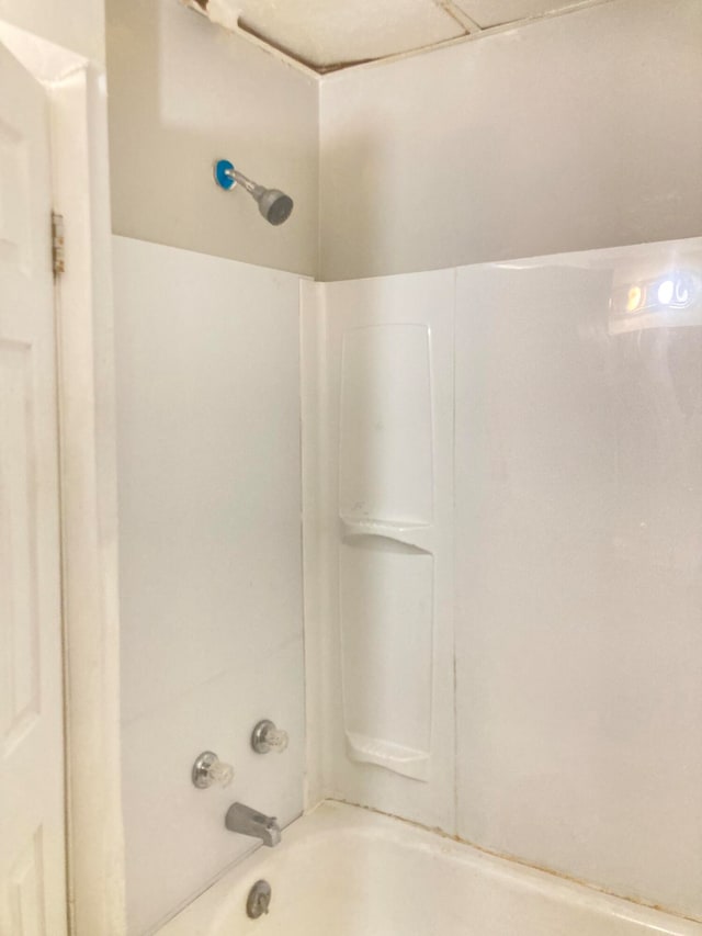 bathroom with shower / bathtub combination