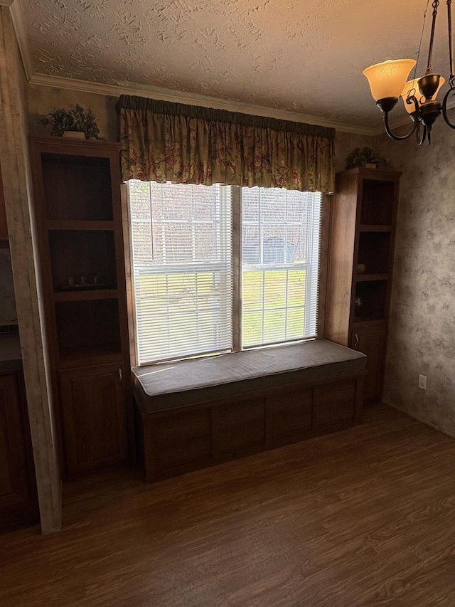 580 Bales Creek Rd, Manchester, KY 40962 - unfurnished dining area with dark wood-type flooring, a chandelier, ornamental molding, and a textured ceiling