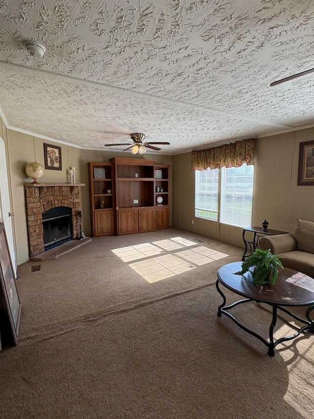 living room featuring crown molding, a stone fireplace, a textured ceiling, light carpet, and ceiling fan