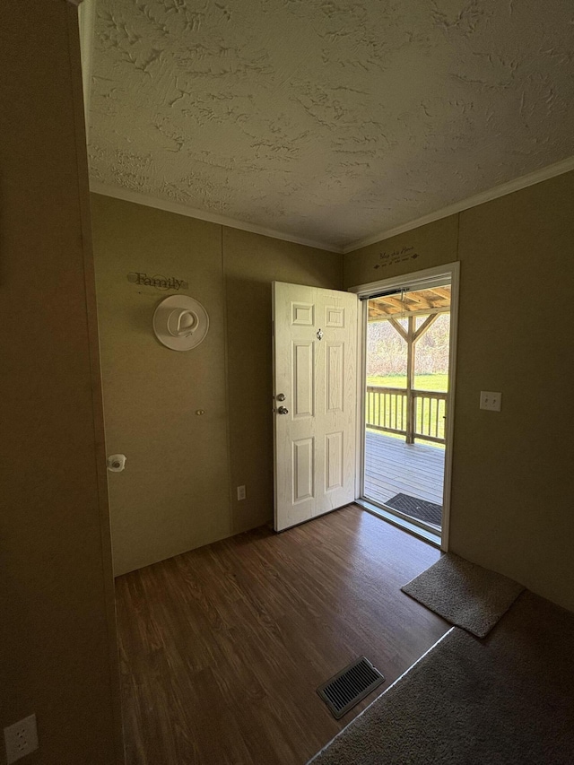 580 Bales Creek Rd, Manchester, KY 40962 - entryway featuring a textured ceiling, ornamental molding, and dark wood finished floors