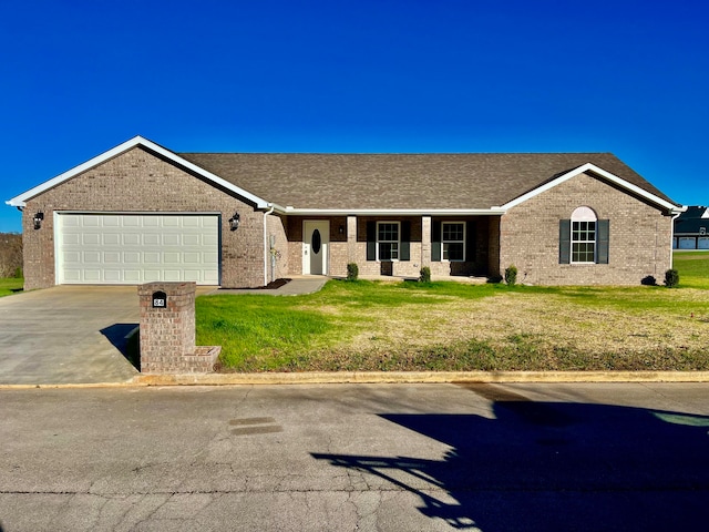 ranch-style home featuring a front lawn and a garage