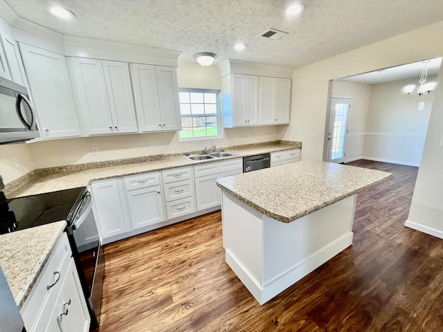 kitchen featuring white cabinets, appliances with stainless steel finishes, and a kitchen island