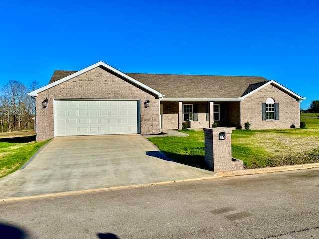 single story home featuring a front lawn and a garage