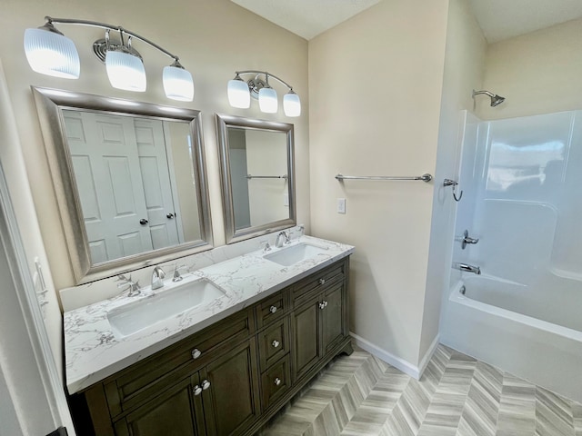 bathroom with vanity and shower / bathtub combination