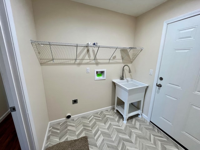 washroom featuring light parquet floors, electric dryer hookup, and washer hookup