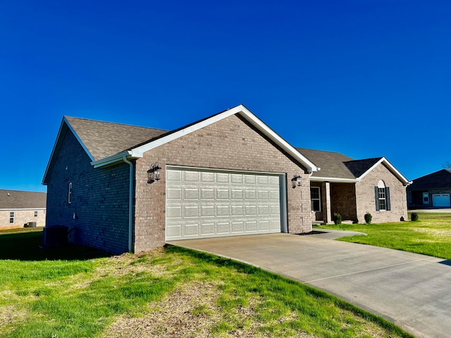 ranch-style house featuring a garage and a front yard