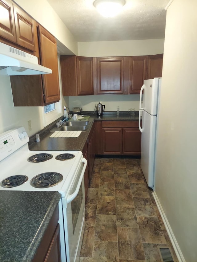 kitchen with white appliances and sink