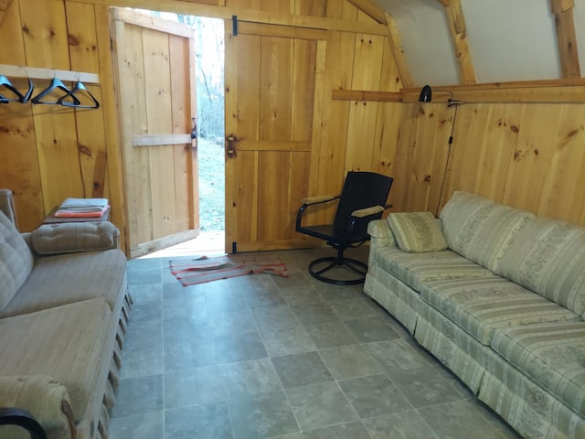 living room featuring wood walls