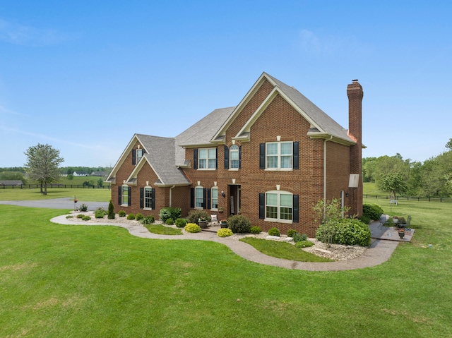 view of front of home with a front lawn