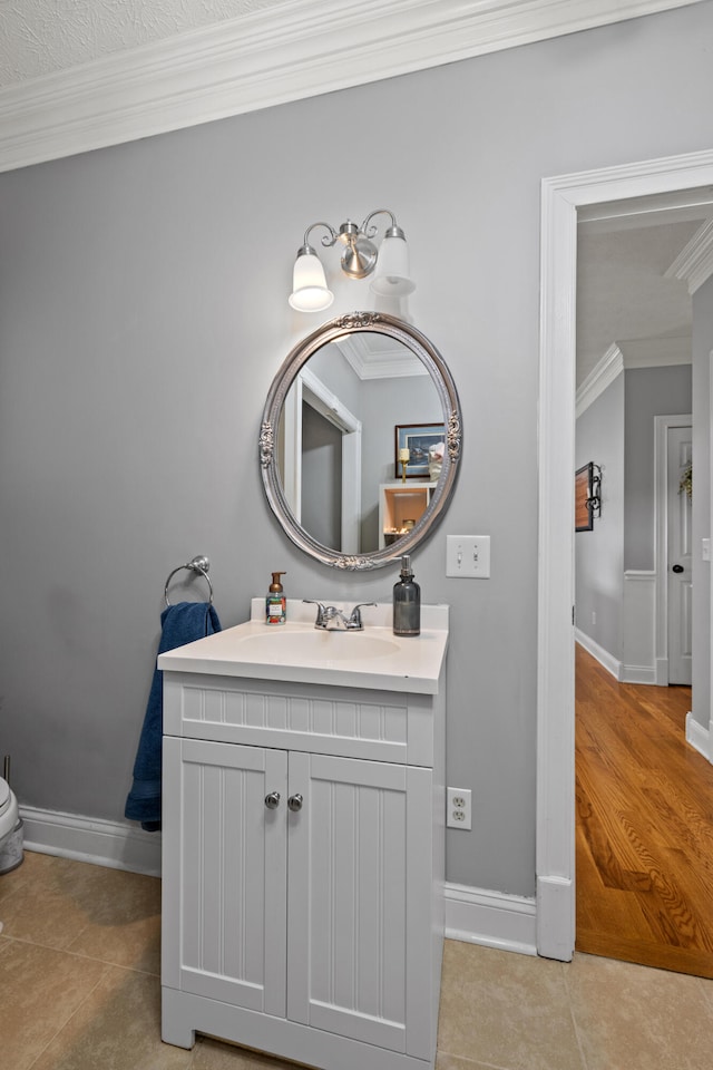 bathroom with vanity, tile patterned floors, and crown molding