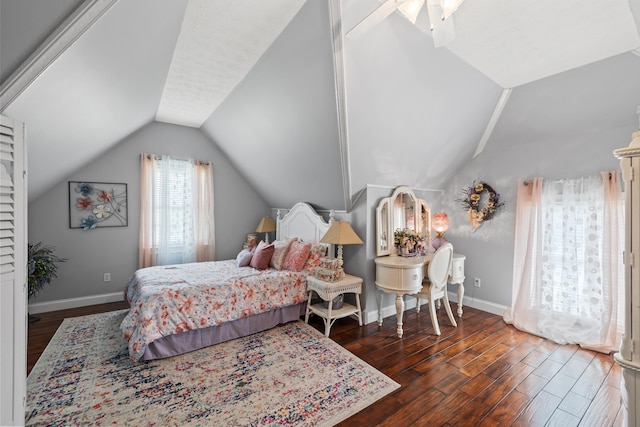 bedroom with vaulted ceiling, ceiling fan, and dark hardwood / wood-style flooring