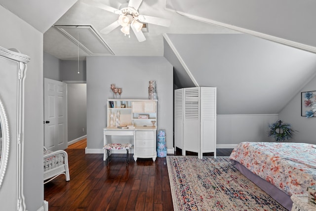 bedroom with dark hardwood / wood-style flooring, vaulted ceiling, and ceiling fan