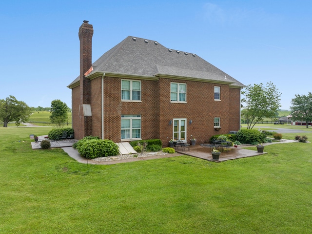 back of house featuring a patio and a lawn