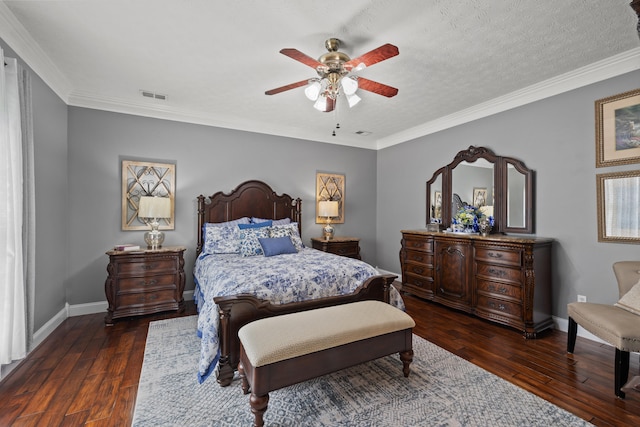 bedroom featuring ornamental molding, a textured ceiling, dark hardwood / wood-style floors, and ceiling fan