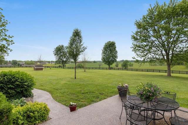 view of yard featuring a patio and a rural view