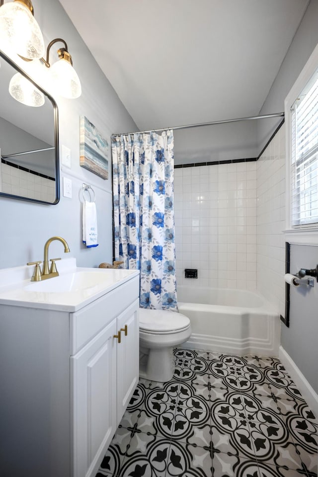 full bathroom featuring tile patterned flooring, vanity, toilet, and shower / tub combo