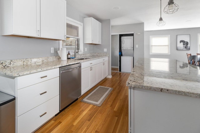 kitchen with sink, decorative light fixtures, dishwasher, light hardwood / wood-style floors, and white cabinetry