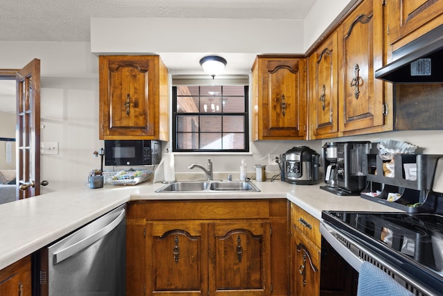 kitchen with electric range, dishwasher, sink, and a textured ceiling