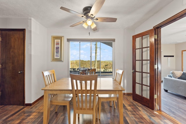 dining area with french doors, a textured ceiling, dark hardwood / wood-style floors, and ceiling fan