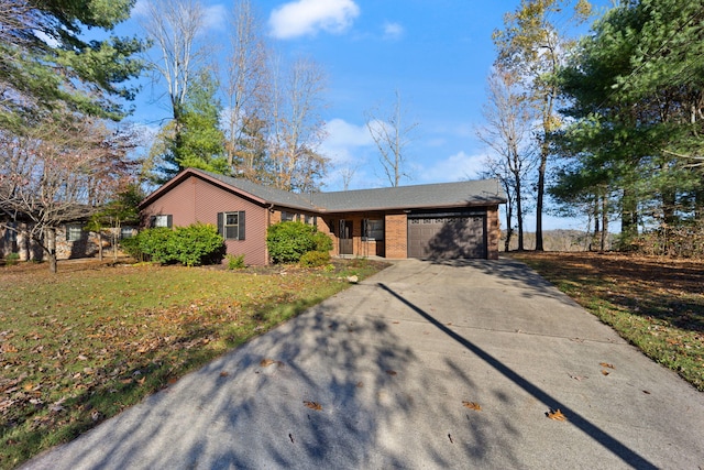 ranch-style house with a front yard and a garage