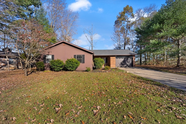 ranch-style house with a garage and a front lawn