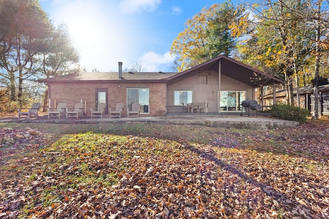 rear view of property with a patio