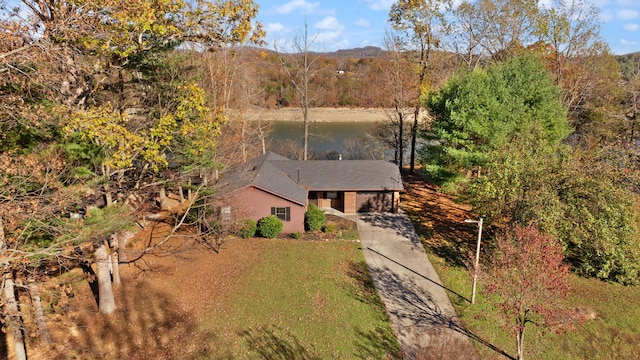 birds eye view of property with a water view