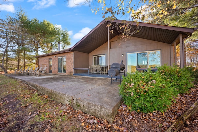 back of property with a patio