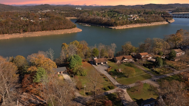 aerial view at dusk with a water view