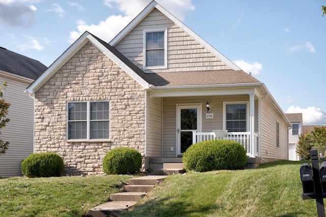 view of front facade featuring a front yard and a porch