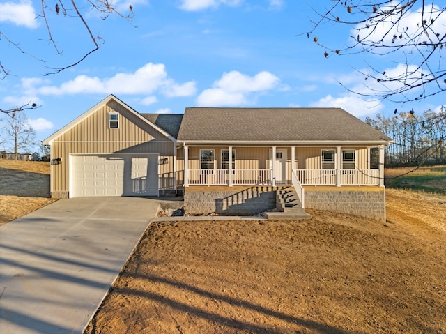 view of front facade featuring covered porch and a garage