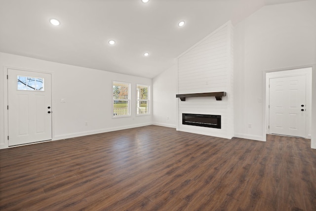 unfurnished living room with a fireplace, dark hardwood / wood-style flooring, and high vaulted ceiling