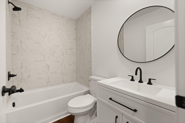 full bathroom featuring toilet, vanity, and tiled shower / bath