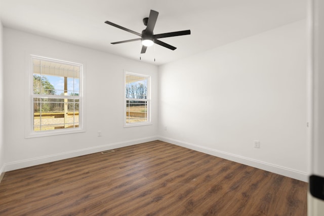 unfurnished room featuring ceiling fan and dark hardwood / wood-style floors