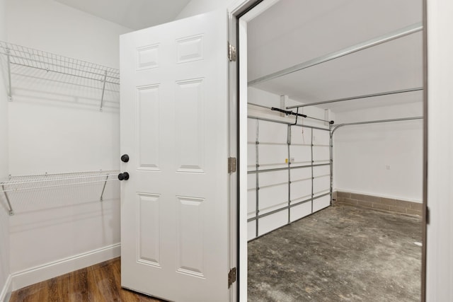 walk in closet featuring dark wood-type flooring