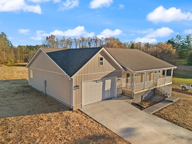 view of front facade featuring covered porch and a garage