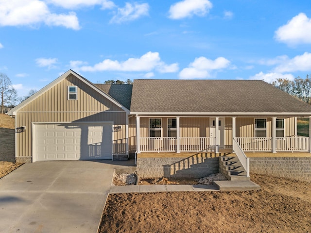 view of front of home featuring covered porch and a garage