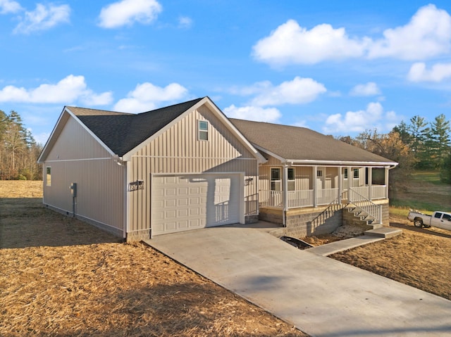 view of front of home with a garage and covered porch