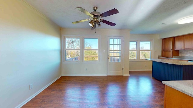 interior space with light stone counters, a textured ceiling, dark hardwood / wood-style floors, ceiling fan, and backsplash