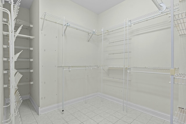 walk in closet featuring tile patterned flooring